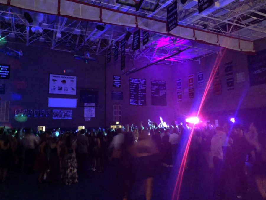  “When my friends and I arrived, we went straight to the gym to dance.  The decorations were pretty, and the robots by the water were super cool, ” Kayla McClain (12) said.
