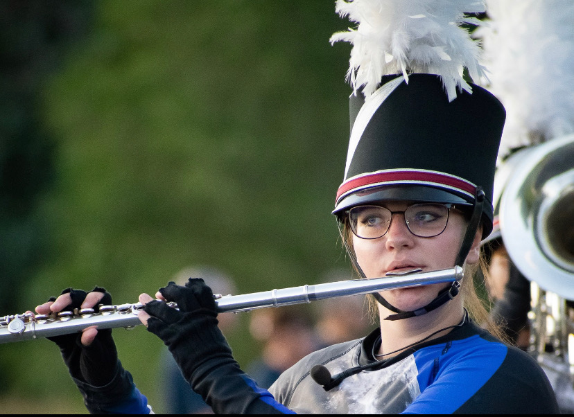 Olivia Cisson marches with her team to victory.