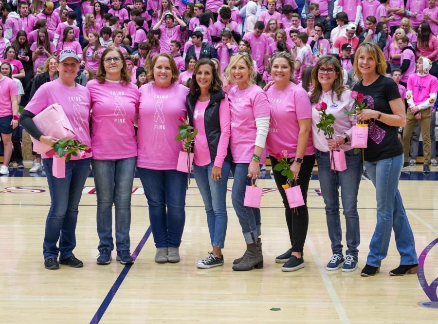 8 lovely ad strong women were recognized at half time for their battles and victories against Breast Cancer.