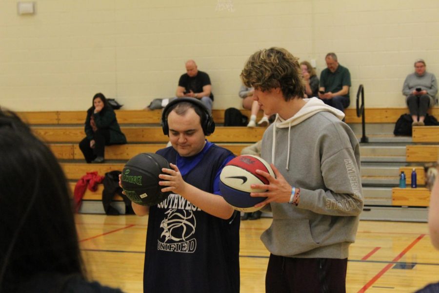 
Photo Credits: Ryan Osborne

Junior Luke Loehding teaches a Unified Basketball player the to pass a basketball