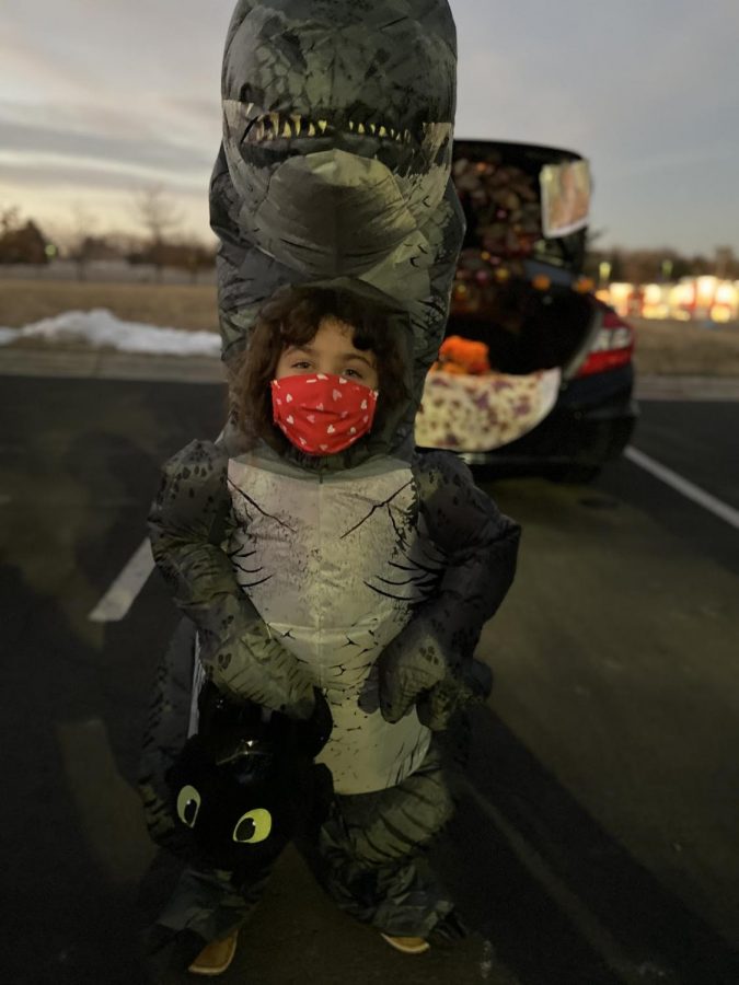 Six year old Anneliese Barwick, attending the Light of the World Church trunk or treat event while safely dressed up as the famous T-rex.