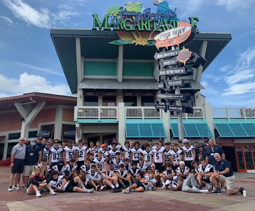 Dakota Ridge football team in front of Jimmy Buffet's Margaritaville.
