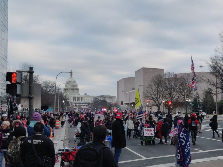 January 6th, 2021 near the Capitol in Washington, D.C. during the riot. The crowd carried their Trump and American flags as they marched forward. 