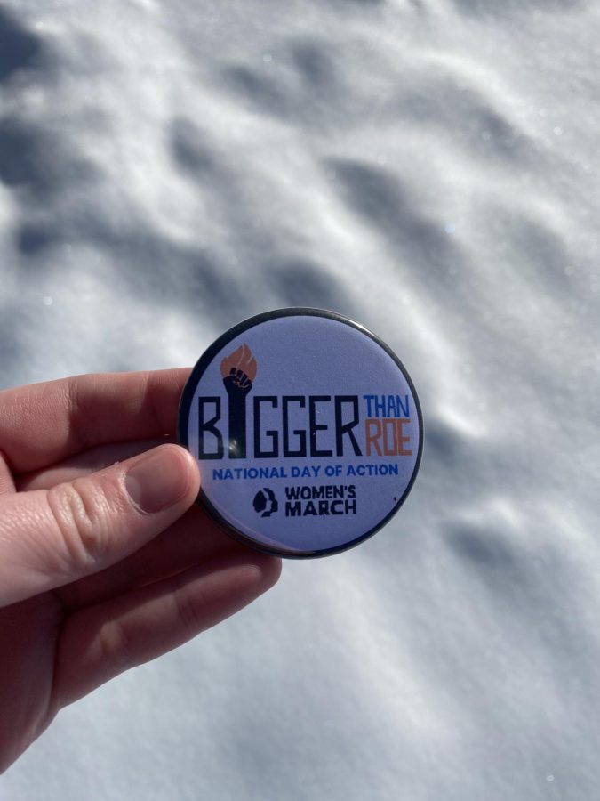 Buttons were distributed to Womens March protesters. 