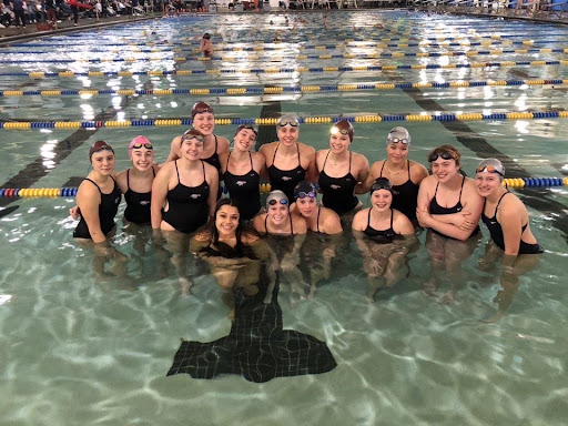 Swim team members gather together after a meet.