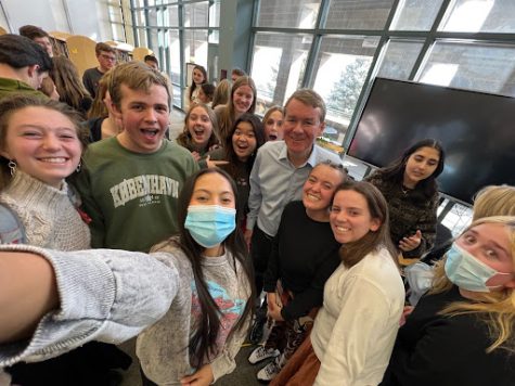 Dakota Ridge High School students taking pictures with Senator Bennet. 