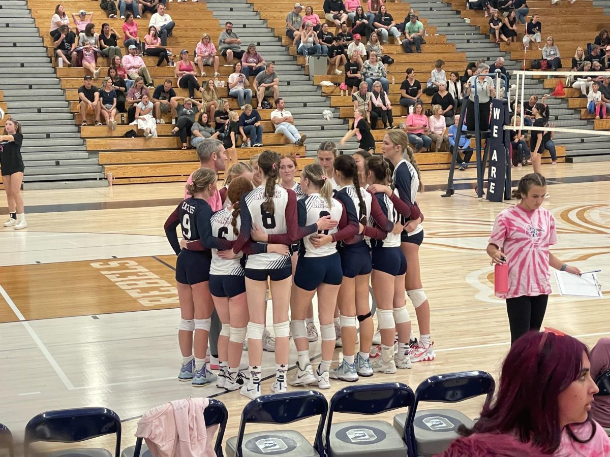 DRHS+varsity+volleyball+girls+huddled+together+after+a+great+play.+They+managed+to+keep+together+and+maintain+a+powerful+front+against+their+rival+Columbine