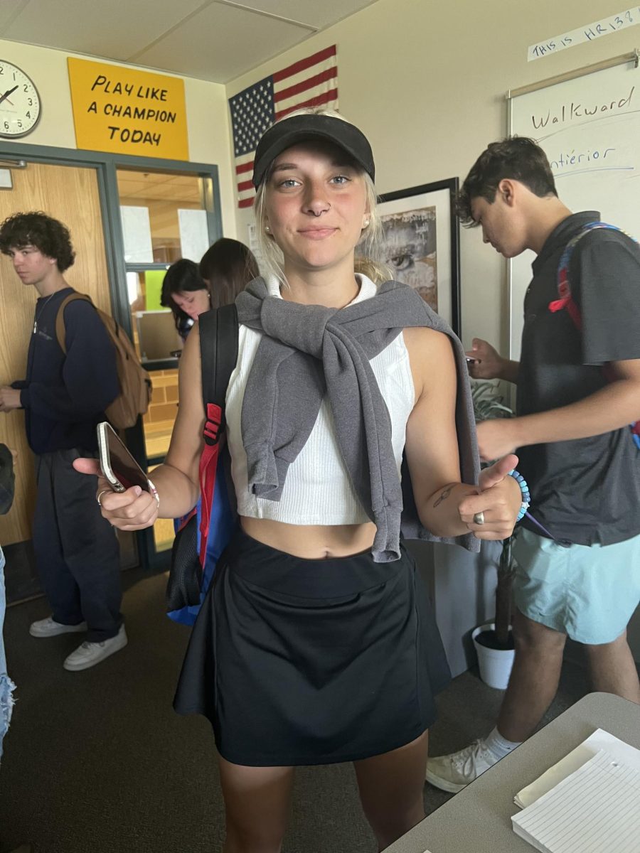 Maia Marone displays country club attire in the country vs. country club war.