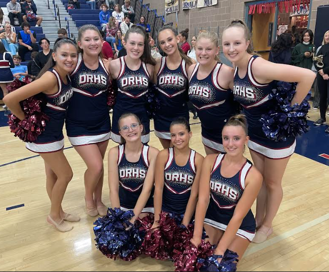 Varsity poms after they entertain the audience with a dance routine.

