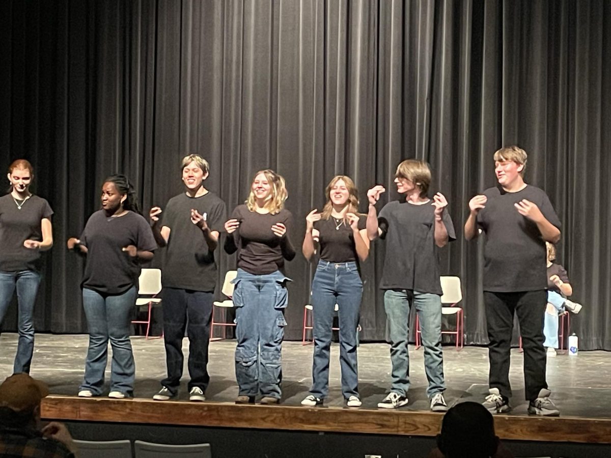 Improv actors wow the crowd with their united performance.