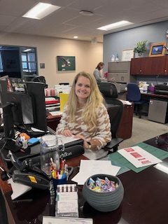 Ms. Cooper is always right in the middle of the office with a bowl of candy for any student who comes to say hi. 
“My desk is in the middle of the main office, so I get to interact with all of the students and staff who come through and help them in any way that I can,” Cooper said.