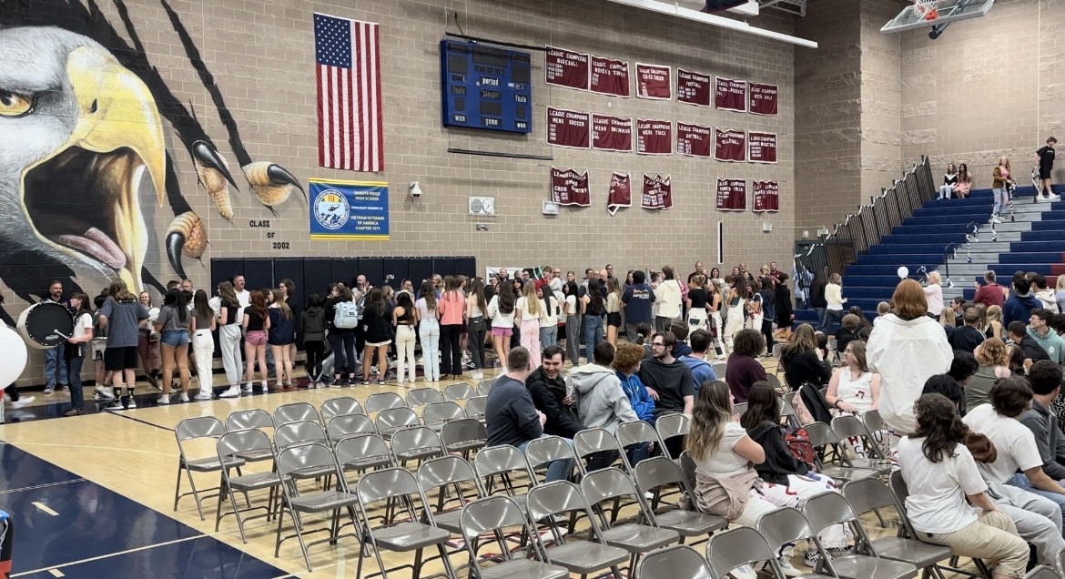 Starting a new tradition, upcoming freshmen from Summit Ridge take their freshman seats during the senior assembly on May 6.