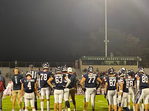 Teammates watch as the Dakota Ridge Eagles securee the win in the final quarter on October 10, 2024.