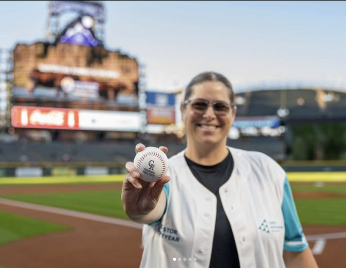 DRHS business teacher Rachel Caliga throws out the first pitch at Coors Field on September 21, 2024 in honor of her Junior Achievement Teacher of the Year Award. 