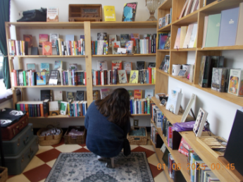 A picture of me at an independent bookstore, Spell Books, in Downtown Littleton. 