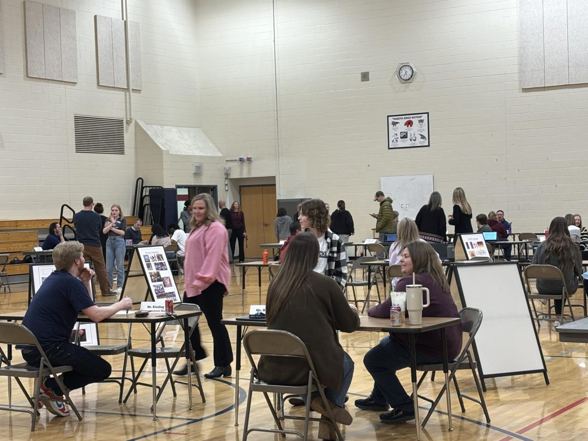 Parent-teacher conferences in the auxiliary gym on February 13, 2025. It´s that time of year again! Students and parents discuss plans of action with teachers for success. 