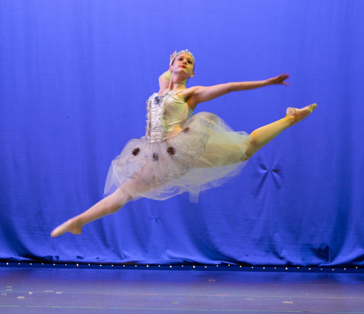 Irelynd Wallce leaps on the Englewood High School stage while performing The Snow Queen in the LCDC version of The Nutcracker in 2024.
