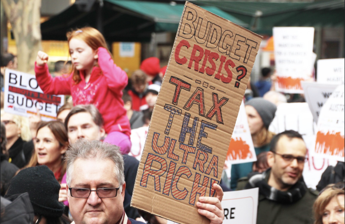 Bust the Budget Melbourne march and rally held in 2014, shows just how long the impact of the ultra rich has been going on. 