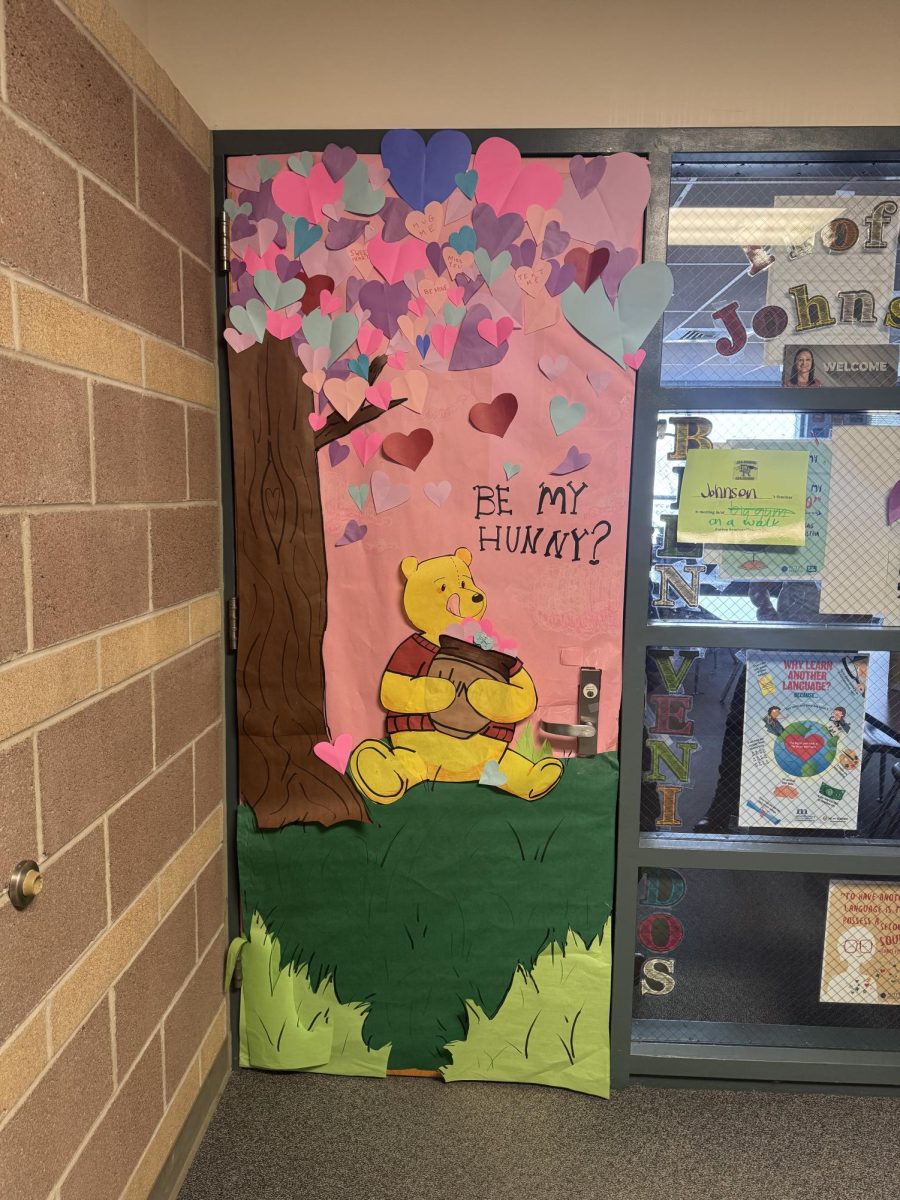 The annual Valentine's Day door winners include Ms. Johnson's sophomores (shown above), Ms. Sullivan's freshmen, Ms. Caliga's Jjuniors, and Ms. Marko's seniors. "We're so excited that we won the door. My Seminar worked hard on it, and this is our second year runnin', so, who knows, maybe we'll win next year, too."